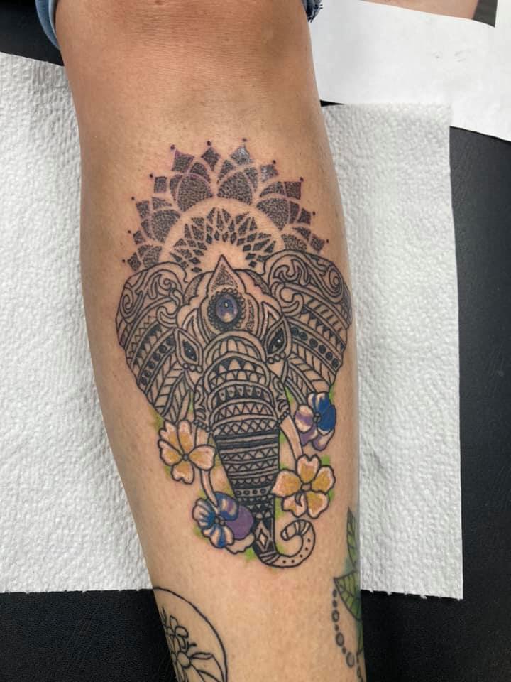 Beautiful Mandala elephant tattoo with flowers design