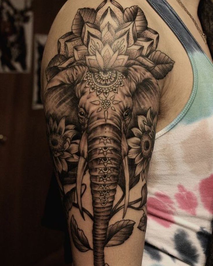 Beautiful Mandala elephant tattoo with flowers