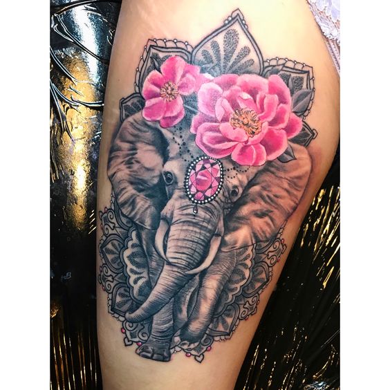 Mandala elephant tattoo with flowers design