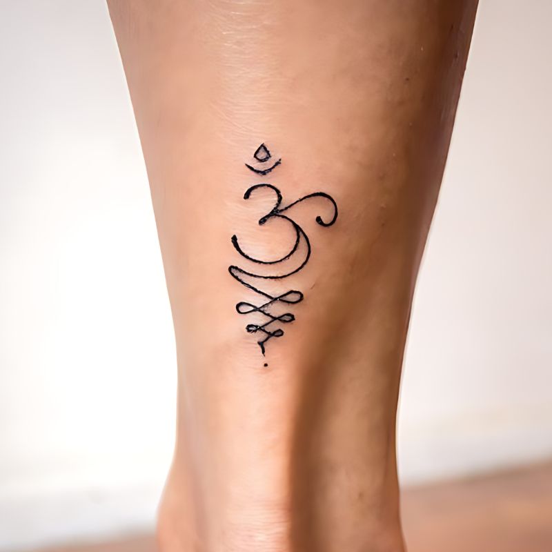 Breathe Symbol Tattoos with Om Symbol Tattoo on foot